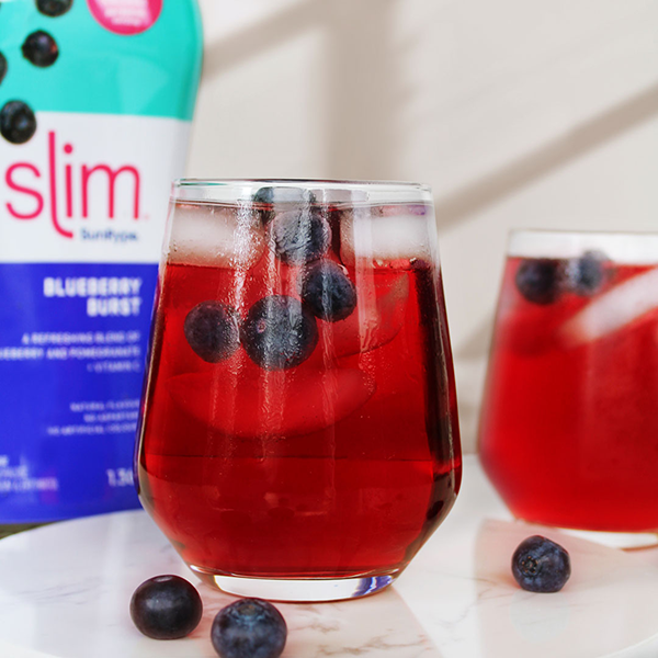 Vibrant blueberry cocktail with ice and berries