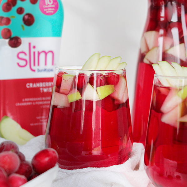 Festive cranberry sangria with citrus slice